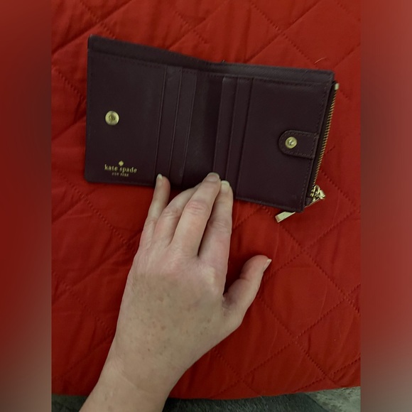 Kate Spade Burgundy/Wine Bifold Wallet with Gold Tone Accents. - Picture 3 of 9
